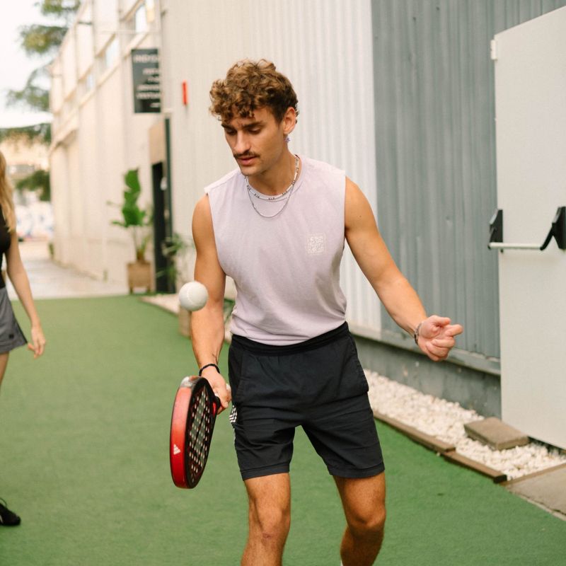 A Brunch Club member playing padel